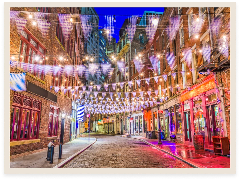 Colorful festive street with hanging lights.